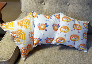 three 12" Square Pillows Orange Taino Symbols